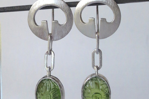 Silver and carved peridot earrigs.