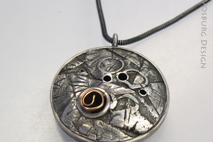 Fused Silver hollow form disk pendant with 14K gold accent.