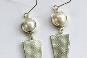 Silver earrings with Mabe pearls and textured panels