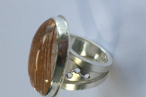 Silver ring with large rutilated quartz cabochon